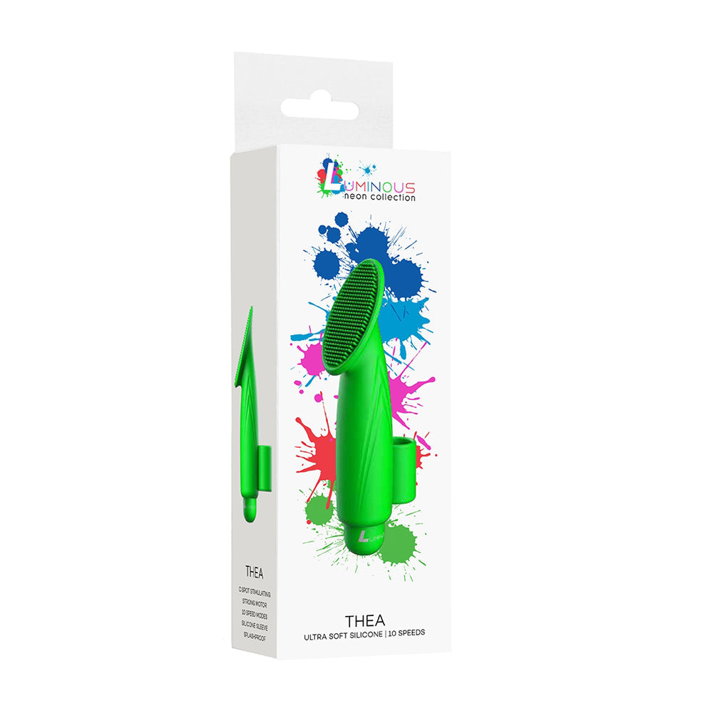 Green silicone product with colorful splashes on a white background