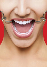 A person grins broadly as the Ouch Hook Gag with Leather Straps O/S pulls their mouth corners apart, showing their teeth against a vivid red backdrop.