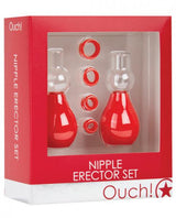 A red and white Ouch Nipple Erector Set box displays two red and clear nipple pumps and four small red rings through a transparent window.