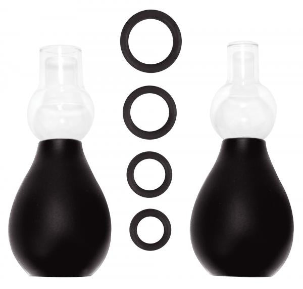 The Ouch Nipple Erector Set includes two bulb-shaped black and clear silicone suction devices, displayed upright, with four black nipple rings in varying sizes between them—perfect for versatile nipple stimulation.