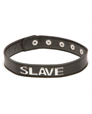 The Talk Dirty To Me Collar - Slave by Allure Lingerie is a black leather BDSM collar with snap buttons and metal letters spelling "SLAVE" on the front.