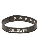 The Talk Dirty To Me Collar - Slave by Allure Lingerie is a black leather BDSM collar with snap buttons and metal letters spelling "SLAVE" on the front.